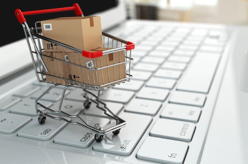 A shopping cart sitting on top of a keyboard.